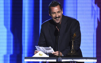 Adam Sandler accepts the award for best male lead for "Uncut Gems" at the 35th Film Independent Spirit Awards on February 8, 2020, in Santa Monica, California. (AP Photo/Chris Pizzello)