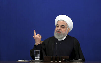 Then-Iranian president Hassan Rouhani gives a press conference in Tehran, Iran, February 16, 2020. (Ebrahim Noroozi/AP)