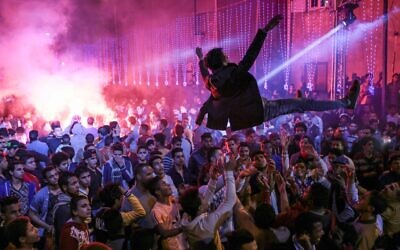 In this March 5, 2015 photo, youth dance at a local wedding in Salam City, a suburb on the outskirts of Cairo, to Mahraganat music. (AP Photo/Mosa'ab Elshamy)