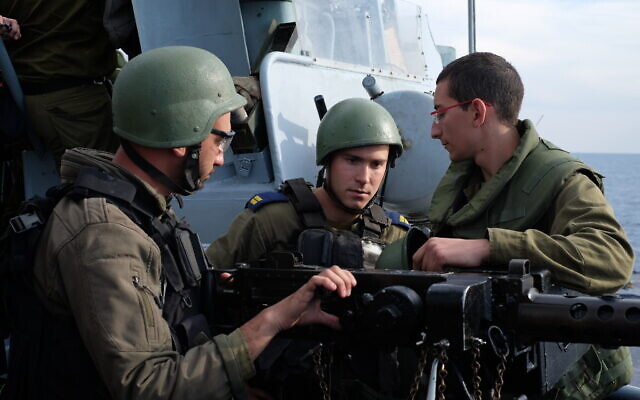 Israeli sailors prepare to fire a machine gun during a naval exercise off the coast of the northern Israeli city of Haifa on February 3, 2020. (Judah Ari Gross/Times of Israel)