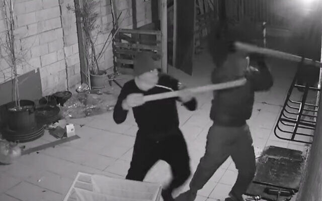 Masked vandals attack the home of a witness who testified against Rabbi Eliezer Berland, a convicted sex offender accused of fraud. (YouTube screenshot)