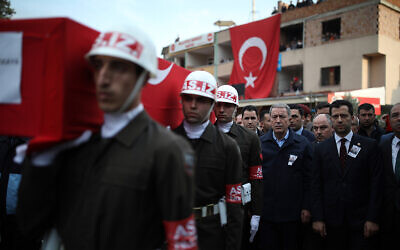 Turkey's Defense Minister Hulusi Akar, third right, attends a funeral ceremony for Halil Ibrahim Akkaya, one of dozens of Turkish soldiers killed in Syria, in Bahce, Osmaniye, Turkey, Feb. 28, 2020. (AP)