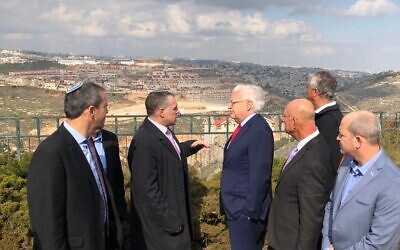 US Ambassador to Israel David Friedman (4th from right) tours the Efrat settlement with settler leaders on February 20, 2020. (Courtesy)