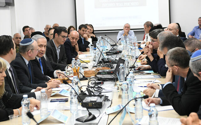 Prime Minister Benjamin Netanyahu, center left, speaks during a situational assessment at the Health Ministry in Jerusalem, February 23, 2020 (Amos Ben Gershom/GPO)
