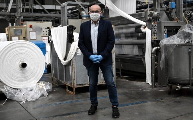 Factory director Fabrizio Sacco poses at the Miroglio masks factory on March 17, 2020 in Govone, near Cuneo, Northwestern Italy.(MARCO BERTORELLO / AFP)
