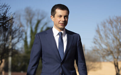 Then-Democratic US presidential candidate and former South Bend, Indiana mayor Pete Buttigieg walks to speak with members of the media, March 1, 2020, in Plains, Georgia. (AP Photo/Matt Rourke)