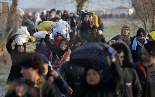 Migrants walk to reach Pazarakule border gate, Edirne, Turkey, at the Turkish-Greek border, March 1, 2020. (Emre Tazegul/AP)