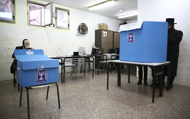 Ultra-orthodox man votes during elections in Bnei Brak, Israel, March 2, 2020. (AP Photo/Oded Balilty)