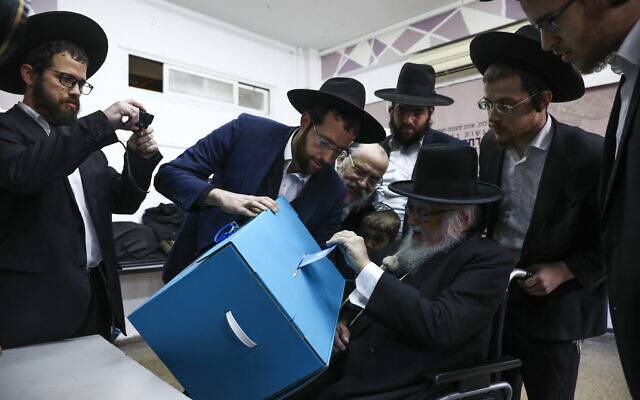 Ultra-orthodox man votes during elections in Bnei Brak, Israel,  March 2, 2020. (AP Photo/Oded Balilty)