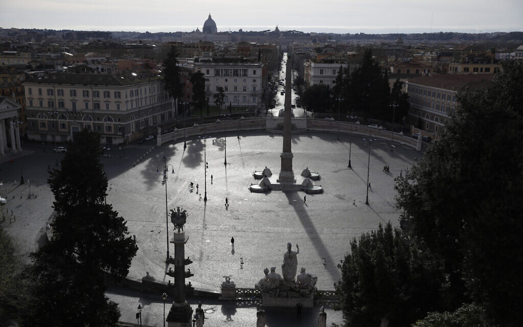 A view of an almost deserted Piazza del Popolo square in Rome, March 12, 2020. (AP Photo/Alessandra Tarantino)