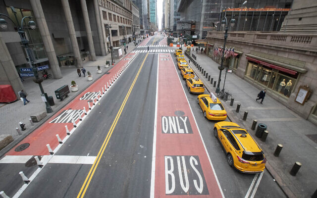 Yellow cabs line an empty 42nd St. waiting for fares outside Grand Central Terminal, in New York, March 25, 2020. (Mary Altaffer/AP)