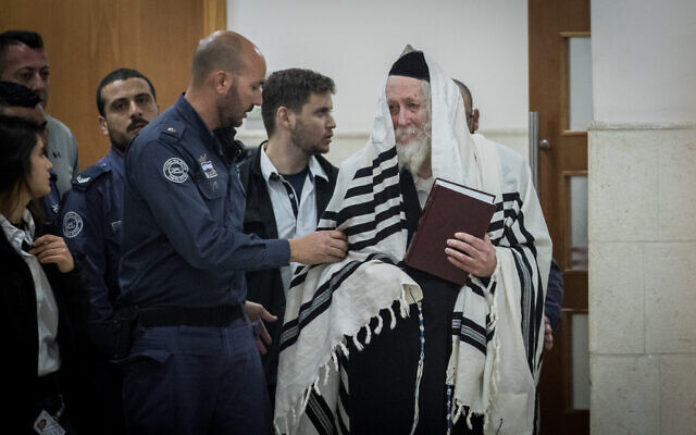 Rabbi Eliezer Berland arrives for a hearing at the Jerusalem District Court on February 28, 2020. (Yonatan Sindel/Flash90)