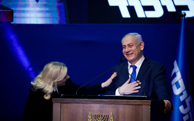 Prime Minister Benjamin Netanyahu and his wife Sara addresses their supporters on the night of the Israeli elections, at the party headquarters in Tel Aviv, on March 3, 2020. (Olivier Fitoussi/Flash90)