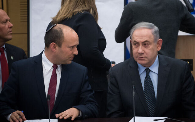 Then-defense minister Naftali Bennett of Yamina, left, and Prime Minister Benjamin Netanyahu during a meeting of right-wing parties, on March 4, 2020. (Yonatan Sindel/Flash90)