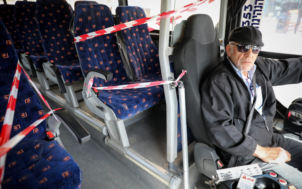 The front seats of a Jerusalem public bus are blocked off on March 10, 2020, as part of preventive measures amid fears over the spread of a new coronavirus.  (Olivier Fitoussi/Flash90)