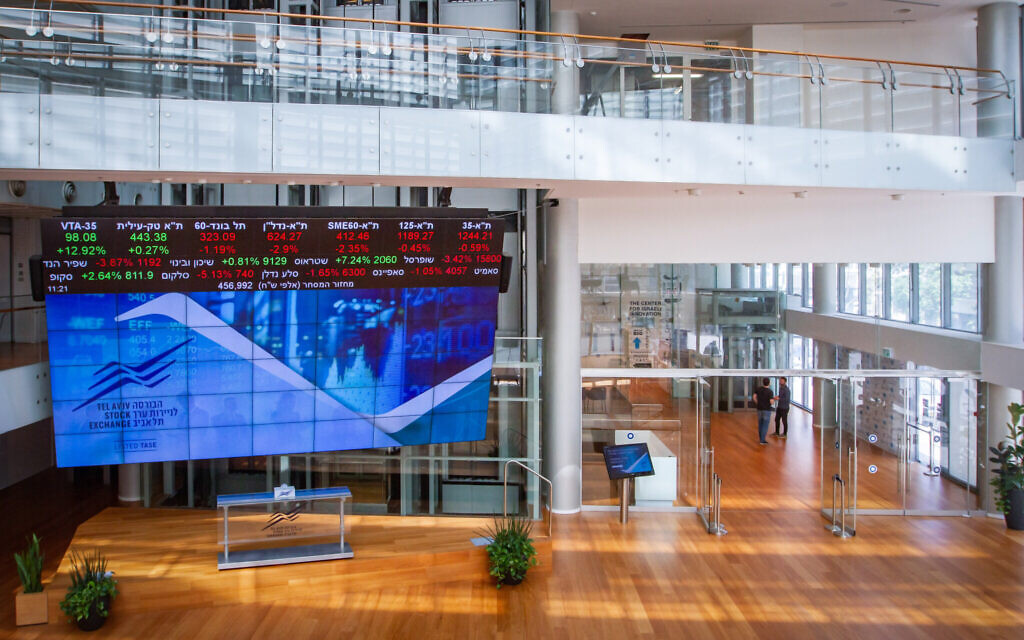 A stock market ticker screen in the lobby of the Tel Aviv Stock Exchange, in the center of Tel Aviv, March 15, 2020. (Flash90)
