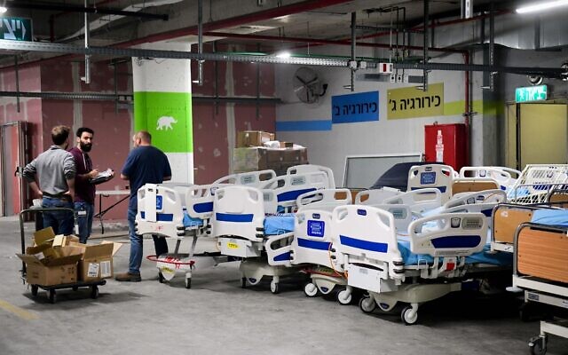 Workers prepare new wards for coronavirus patients at Sheba Hospital in Tel Hashomer on March 17, 2020. (Flash90)