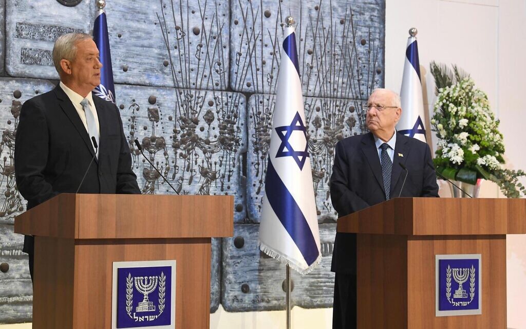 President Reuven Rivlin (R) tasks Blue and White chairman Benny Gantz with forming a government in a ceremony at the President's Residence in Jerusalem on March 16, 2020. (Mark Neyman/GPO)