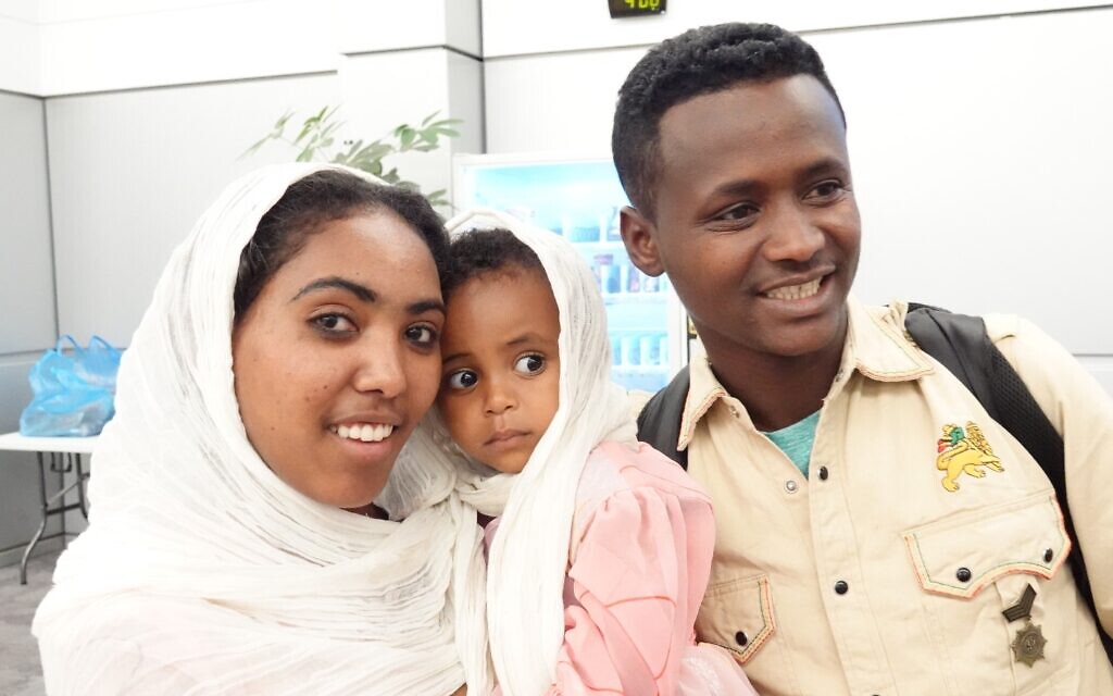 Ethiopian immigrants shortly after landing at Ben Gurion Airport, March 24, 2020. (Michael Dimenstein/ GPO)tein / GPO.
