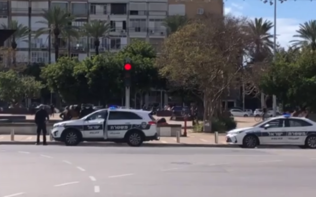 Police seen in Tel Aviv's Rabin Square on Saturday, March 21, 2020 (Channel 12 screenshot)