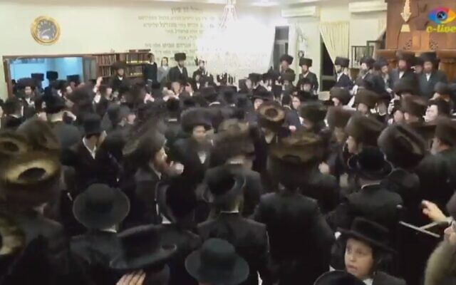 Illustrative: Ultra-Orthodox Israelis dance at a wedding in Beit Shemesh on March 18, 2020 (screenshot: Channel 12)