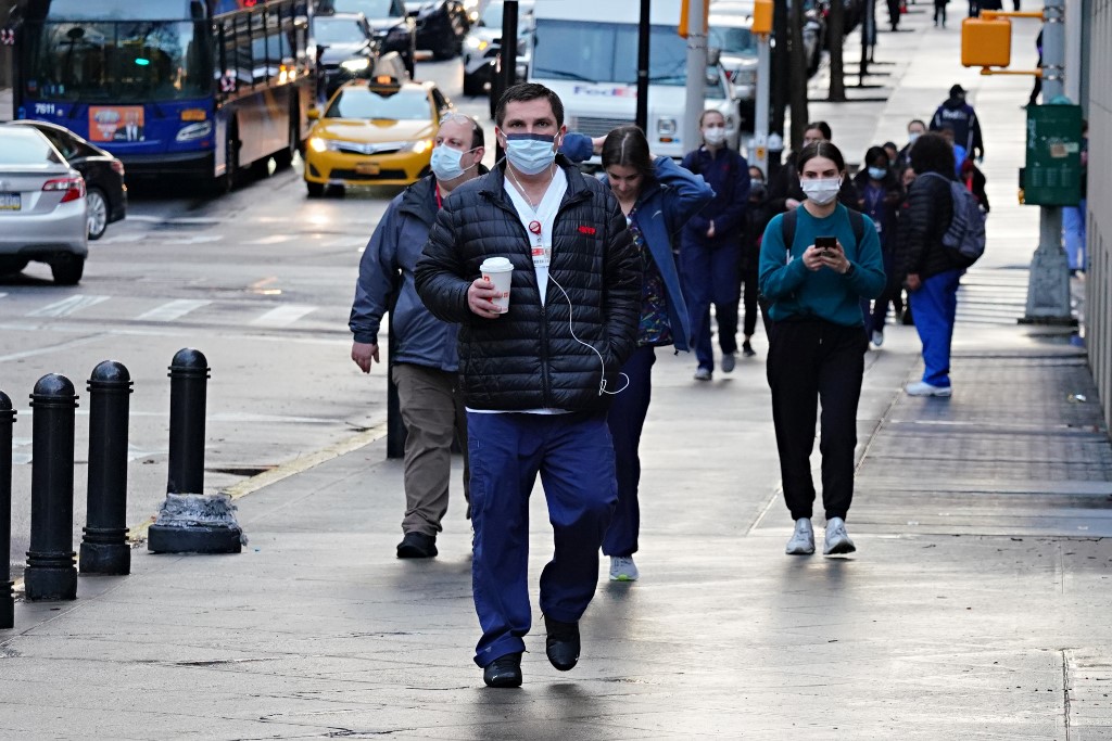 Medical staff arrive for their shift at NewYork-Presbyterian Hospital/Weill Cornell Medical Center during the coronavirus pandemic on April 13, 2020 in New York City. (Cindy Ord/Getty Images/AFP)