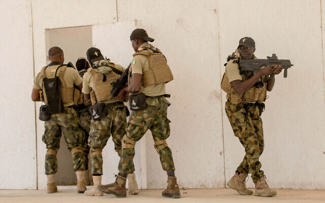 In this February 18, 2020, file photo, Nigerian Navy Special Boat Service troops exercise under the supervision of British special forces during US military-led annual counterterrorism exercise in Thies, Senegal. (AP Photo/Cheikh A.T. Sy, File)