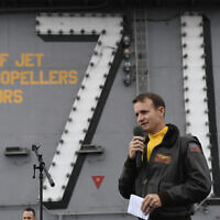 In this Nov. 15, 2029, photo US Navy Capt. Brett Crozier, commanding officer of the aircraft carrier USS Theodore Roosevelt (CVN 71), addresses the crew during an all-hands call on the ship's flight deck while conducting routine operations in the Eastern Pacific Ocean.  (US Navy Photo by Mass Communication Specialist 3rd Class Nicholas Huynh via AP)