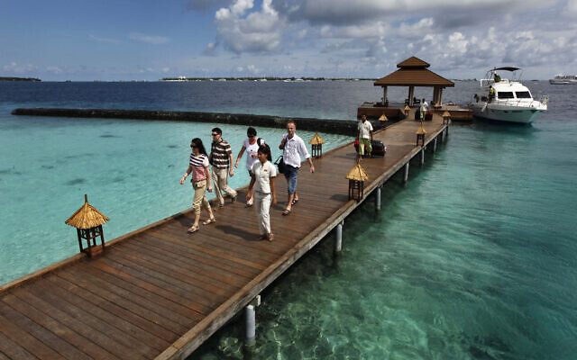 Illustrative: Foreign tourists arrive in a resort in the Kurumba island in Maldives, February 12, 2012. (AP Photo/ Gemunu Amarasinghe, File)