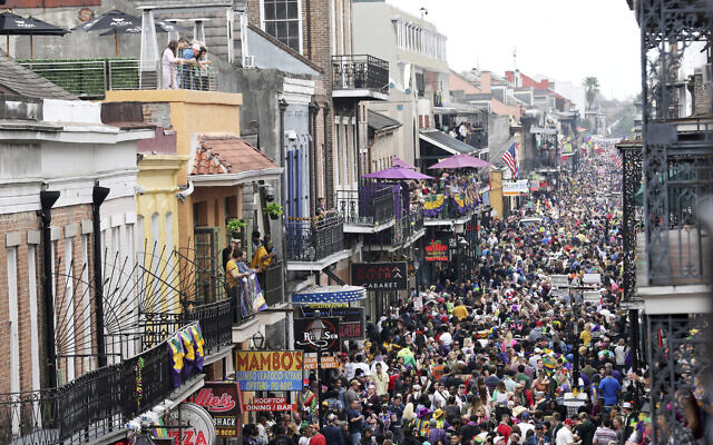 Bourbon Street is a sea of humanity on Mardi Gras day in New Orleans, Tuesday, Feb. 25, 2020. (AP Photo/Rusty Costanza)