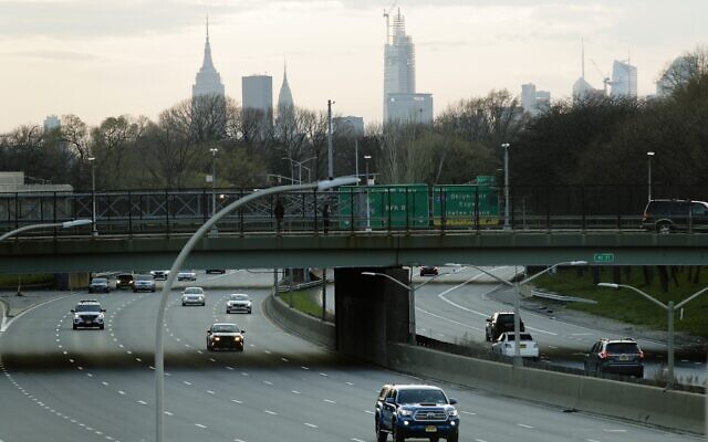 Car driers move on the Grand Central Parkway during rush hour Tuesday, April 7, 2020, in the Queens borough of New York. (AP Photo/Frank Franklin II)