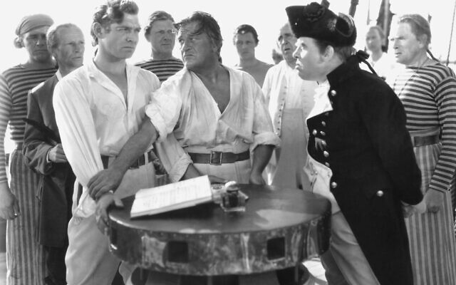 Crew members of the HMS Bounty, including Clark Gable (left) as Fletcher Christian and Charles Laughton (right) as Captain Bligh, in the 1935 film version of Charles Nordhoff and James Norman Hall's Mutiny on the Bounty. (MGM)