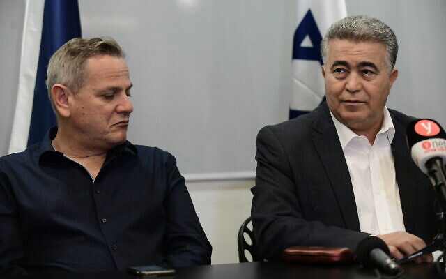 Labor Party leader Amir Peretz (R) and Meretz leader Nitzan Horowitz at a press conference in Tel Aviv on March 12, 2020. (Tomer Neuberg/Flash90)