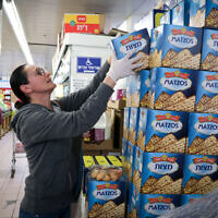 A woman shops for matzah at a supermarket in Jerusalem on March 31, 2020. (Yossi Zamir/Flash90/File)