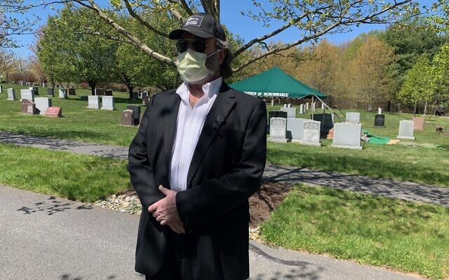 Andrew Grosz, 68, stands nearby his mother’s burial at the Garden of Remembrance Cemetery on Wednesday, April 22, 2020. His mother, Anna Grosz, who survived the Holocaust, died of coronavirus (Courtesy).