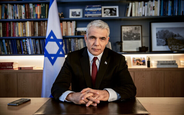 Opposition leader Yair Lapid poses for a photo at his office in Tel Aviv, Israel, May 21, 2020. (AP Photo/Oded Balilty)