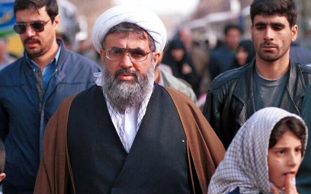 Iran's former intelligence minister Ali Fallahian, escorted by his bodyguards, is seen in Tehran in this Dec. 22, 2000 photo.  (AP Photo/Hasan Sarbakhshian, File)