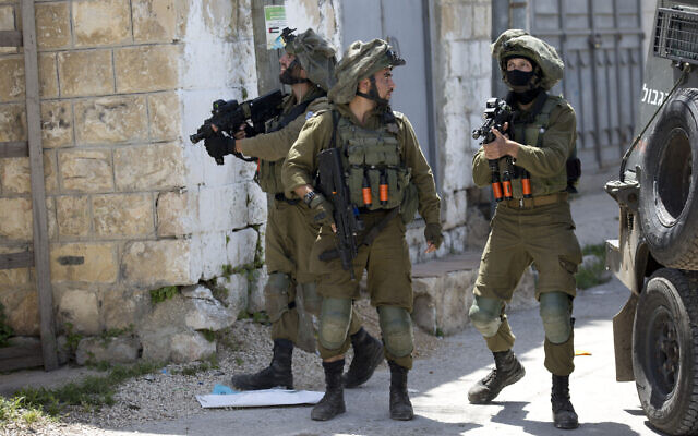 Israeli troops patrol in the northern West Bank village of Yabad after a soldier was killed there during a raid, May, 12, 2020. (AP/Majdi Mohammed)