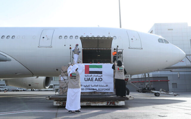 In this photo released by the state-run WAM news agency on May 19, 2020, an Etihad Airways flights loaded with aid for the Palestinians to fight the coronavirus pandemic is loaded in Abu Dhabi, United Arab Emirates. Etihad Airways flew aid for the Palestinians amid the coronavirus pandemic from the capital of the United Arab Emirates into Israel, marking the first known direct commercial flight between the two nations. (WAM via AP)