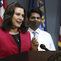 In this Thursday, May 21, 2020 photo provided by the Michigan Office of the Governor, Michigan Gov. Gretchen Whitmer speaks during a news conference in Lansing, Mich. (Michigan Office of the Governor via AP, Pool)