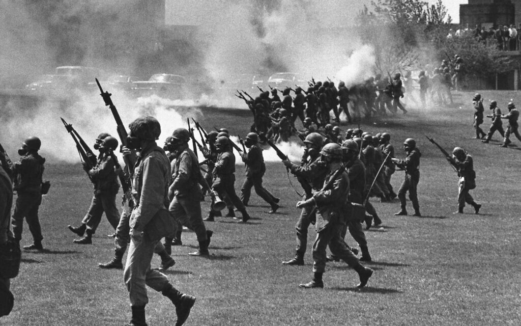 May 4, 1970, the Ohio National Guard moves in on rioting students at Kent State University in Kent, Ohio. Four people were killed and eleven wounded when National Guardsmen opened fire. (AP Photo, File)