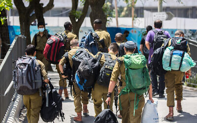 Illustrative: Israeli soldiers seen at the Central Bus Station in Jerusalem, on May 10, 2020. (Olivier Fitoussi/Flash90)