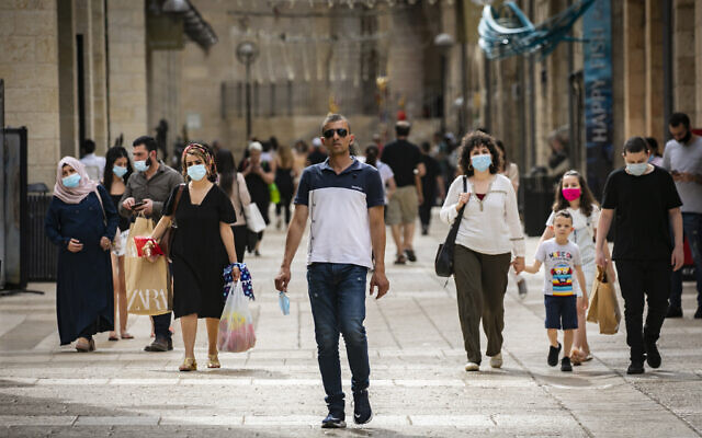 People walk and shop at the Mamilla Mall near Jerusalem's Old City on May 14, 2020. (Olivier Fitoussi/Flash90)