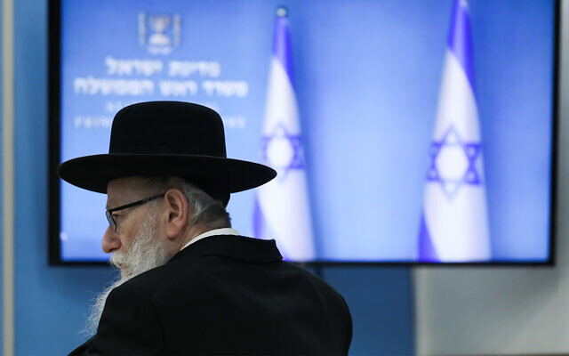 Then-health minister Yaakov Litzman attends a press conference about the coronavirus at the Prime Minister's Office in Jerusalem, March 25, 2020. (Olivier Fitoussi/Flash90)