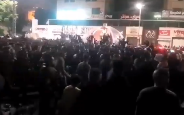 Palestinians gather to protest lockdown measures in Hebron, early Sunday, May 24, 2020 (video screenshot)
