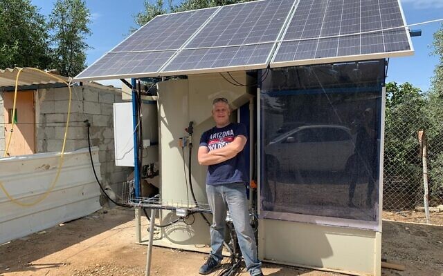 Clive Lipchin in front of a pilot off-grid sewage treatment unit in the Bedouin village of Umm Batin, near Beersheba in the Negev. (Courtesy, Arava Institute)