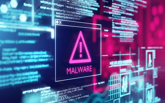 A computer screen with program code warning of a detected malware script program. (solarseven via iStock)