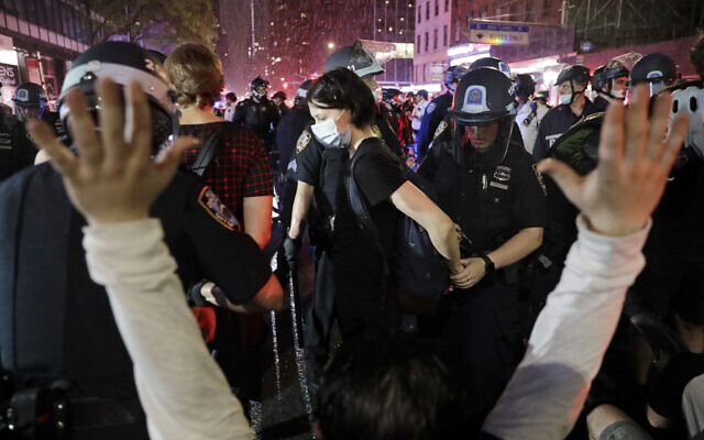 Police arrest protesters as they march through the streets of Manhattan, New York, June 3, 2020. (AP/Seth Wenig)