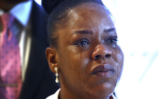 Tomika Miller, center, widow of Rayshard Brooks cries during a news conference, Wednesday, June 17, 2020 in Atlanta. (Curtis Compton/Atlanta Journal-Constitution via AP)