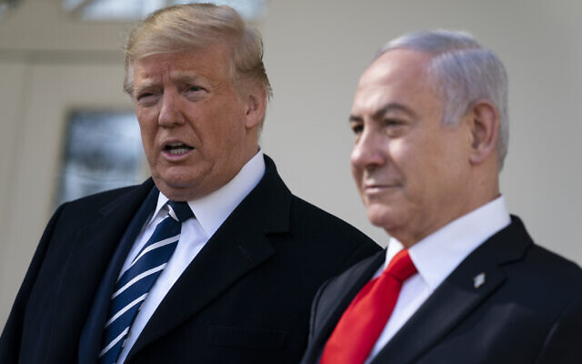 US President Donald Trump and Prime Minister Benjamin Netanyahu talk with reporters before a meeting in the Oval Office of the White House, January 27, 2020, in Washington. (AP Photo/Evan Vucci)